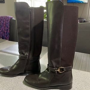 Brown Tall Boots. Slight scratch on the toe